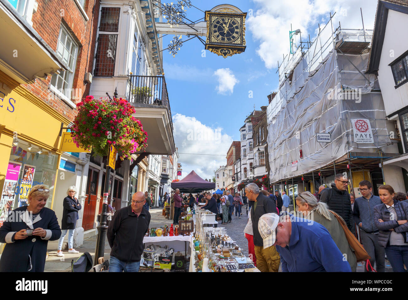 Roadside stall at Guildford Antique & Brocante Street Market and view up High Street, Guildford