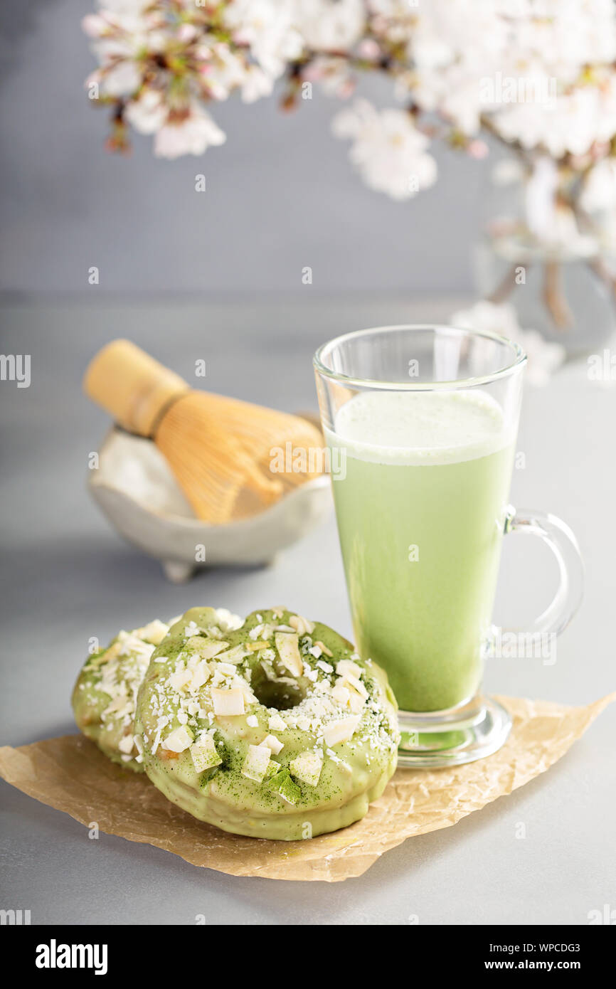 Matcha coconut donuts with matcha latte Stock Photo Alamy
