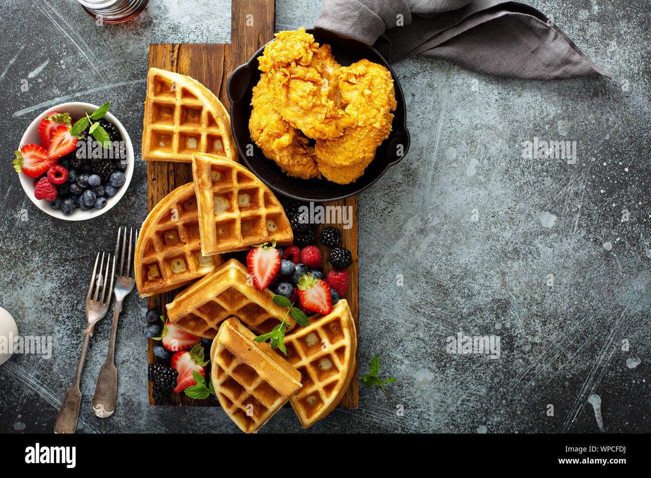 Breakfast platter with waffles, berries and chicken Stock Photo Alamy