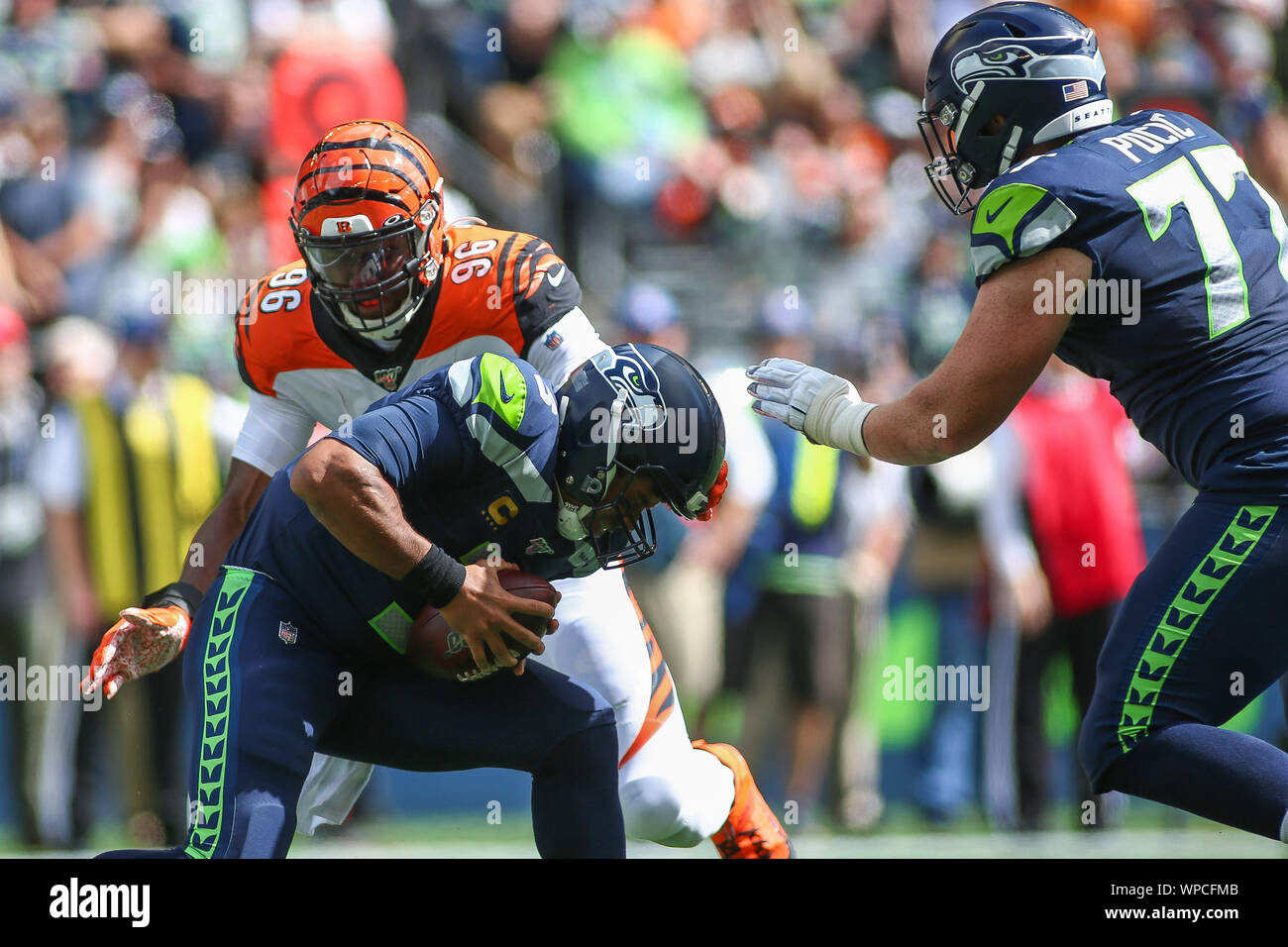 Seattle, WA, USA. 8th Sep, 2019. Seattle Seahawks quarterback Russell  Wilson (3) is sacked by Cincinnati Bengals defensive end Carlos Dunlap (96)  during a game between the Cincinnati Bengals and Seattle Seahawks