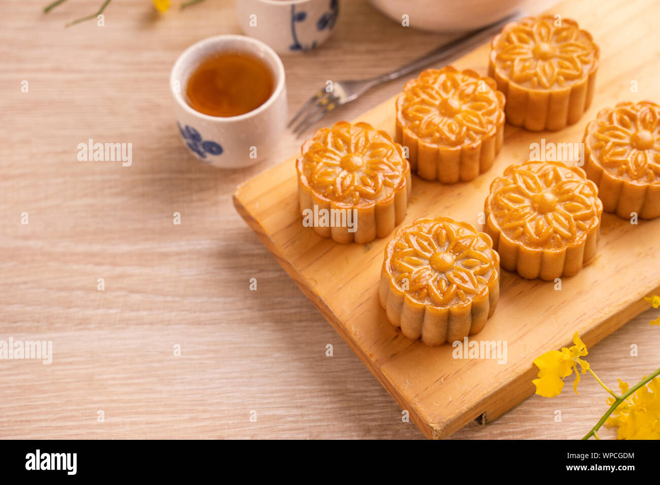 Mid Autumn Festival Holiday Concept Design Of Moon Cake Mooncakes Tea Set On Bright Wooden Table And Serving Plate With Copy Space Close Up Stock Photo Alamy