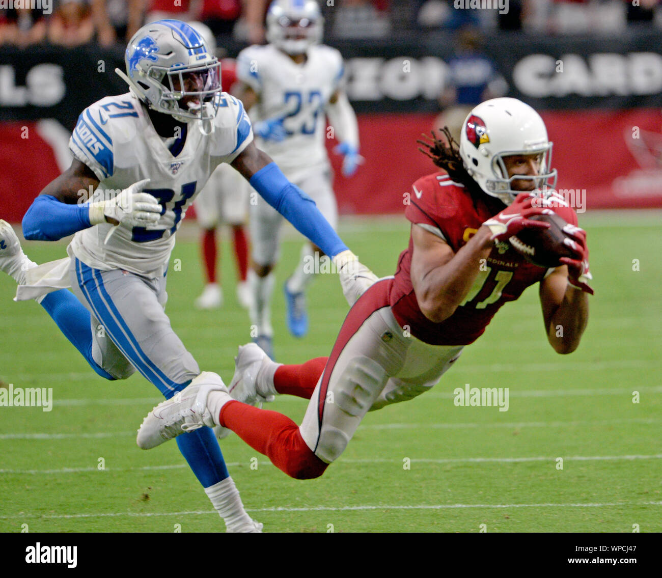 Glendale, Arizona, USA. 08th Sep, 2019. Arizona Cardinals' receiver Larry Fitzgerald (R) makes a diving catch to for a first down as Detroit Lions' Tracy Walker in the fourth quarter at State Farm Stadium in Glendale, Arizona on Sunday, September 8, 2019.  The Lions and Cardinals played to a 27-27 tie. Photo by Art Foxall/UPI Credit: UPI/Alamy Live News Stock Photo