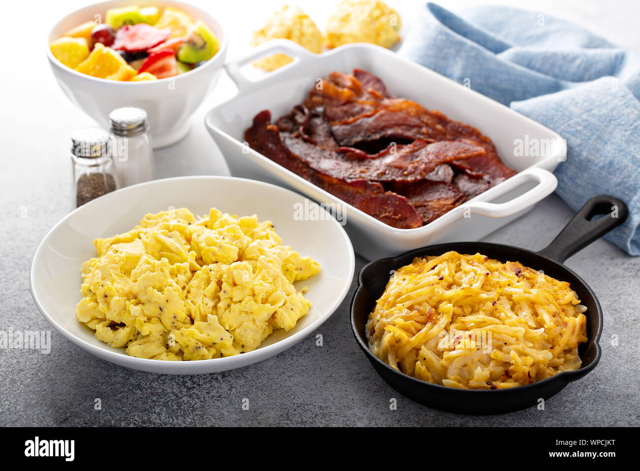 Full breakfast with scrambled eggs, bacon and potatoes Stock Photo - Alamy