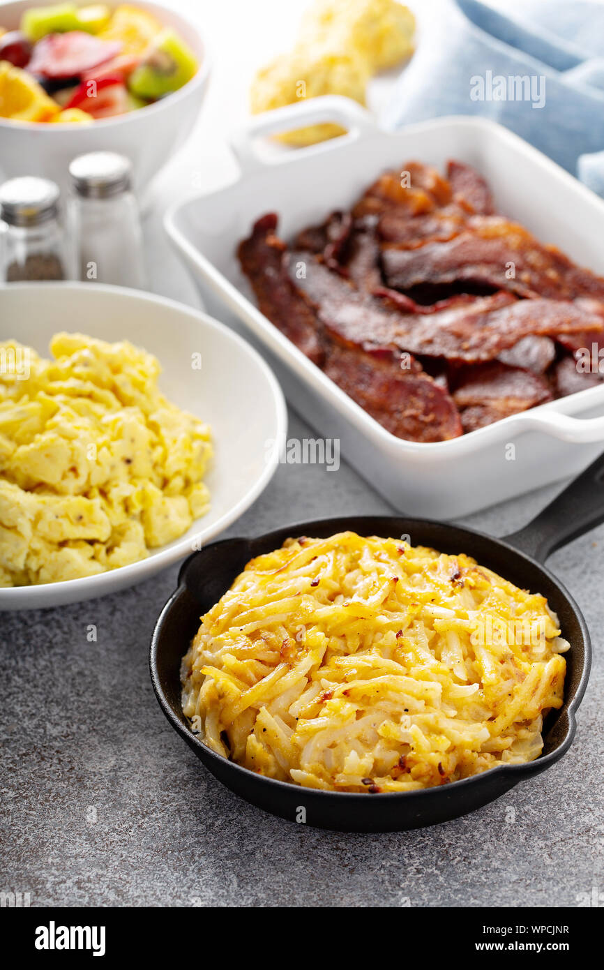Full breakfast with scrambled eggs, bacon and potatoes Stock Photo - Alamy