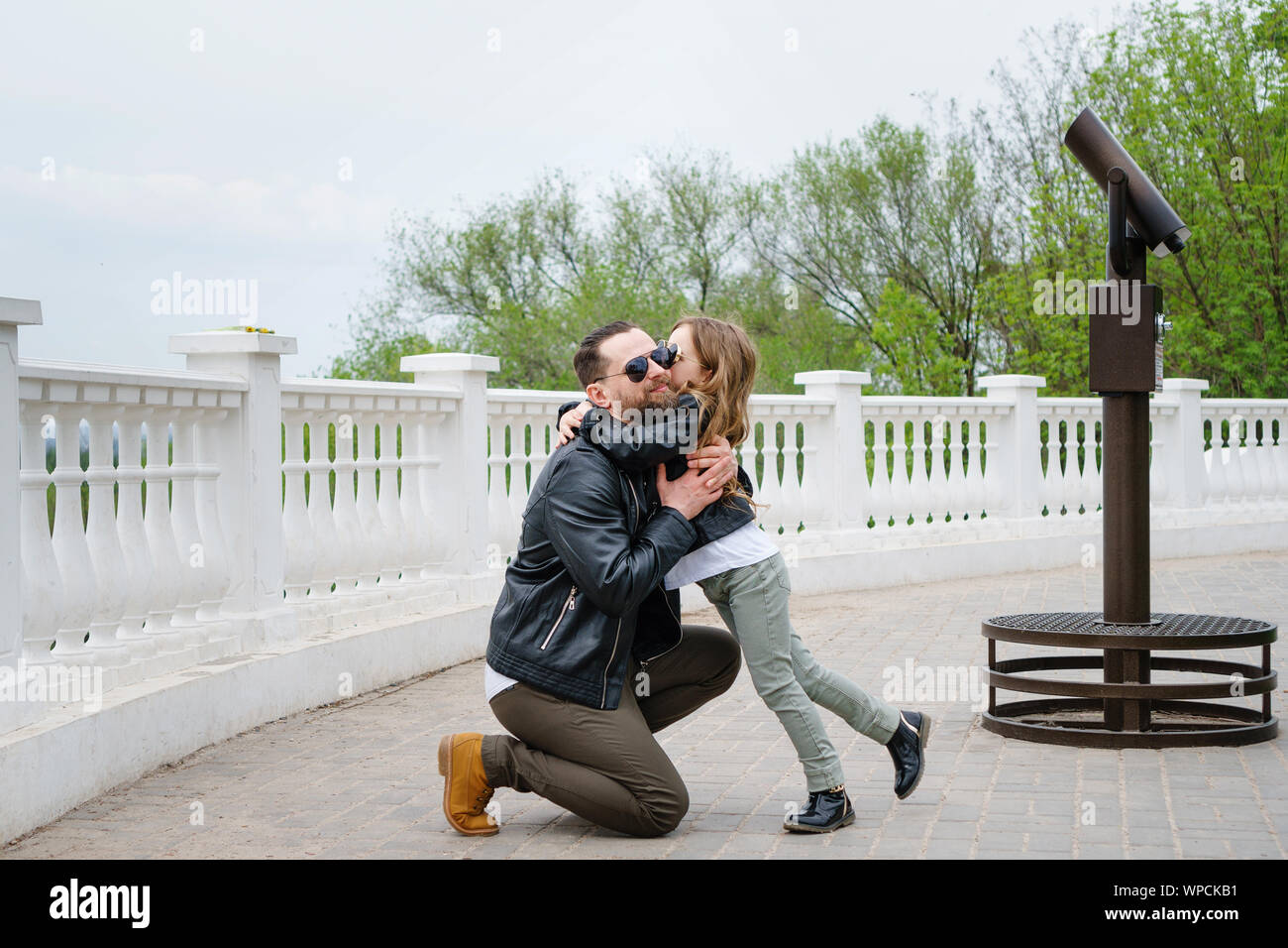 Fashionable stylish family portrait for a walk. Dad and daughter posing on the observation deck. Excursion. Travel and tourism concept. Time together. Stock Photo