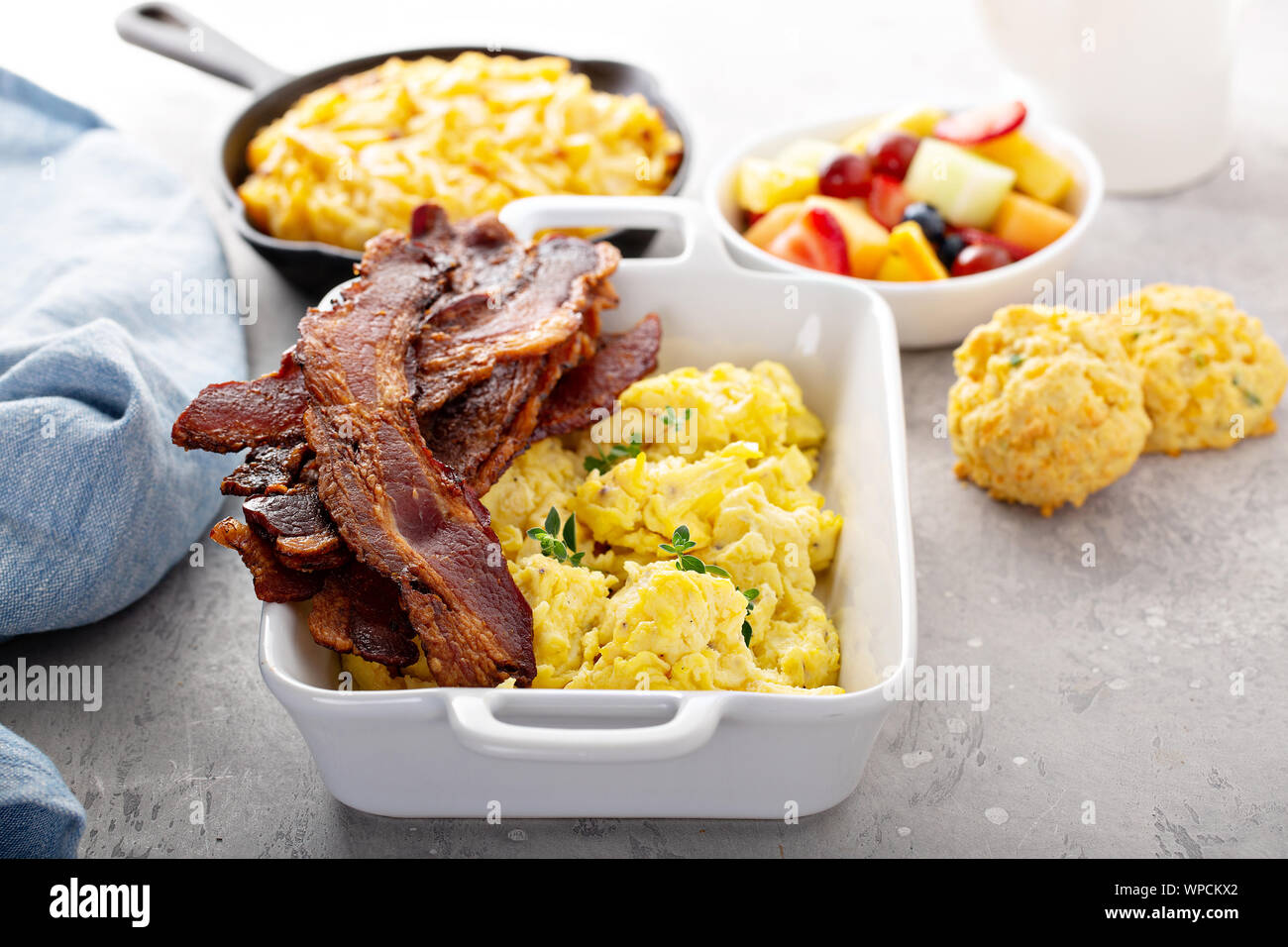 Full breakfast with scrambled eggs, bacon and potatoes Stock Photo - Alamy