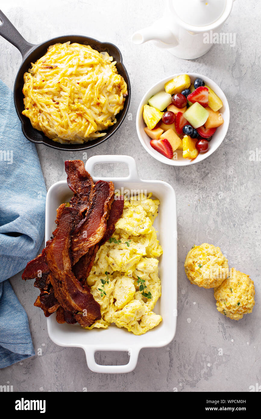 Full breakfast with scrambled eggs, bacon and potatoes Stock Photo