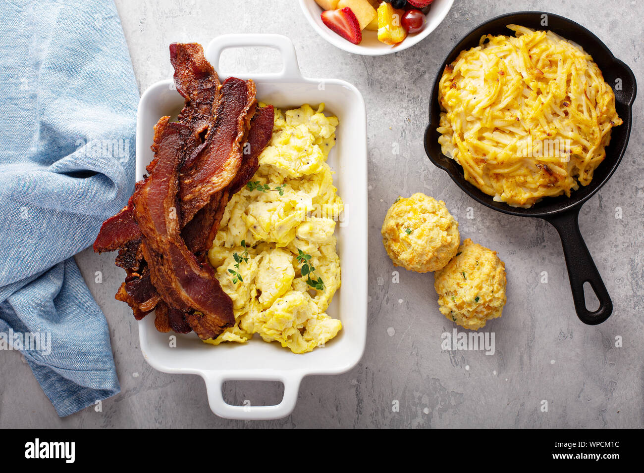 Full breakfast with scrambled eggs, bacon and potatoes Stock Photo