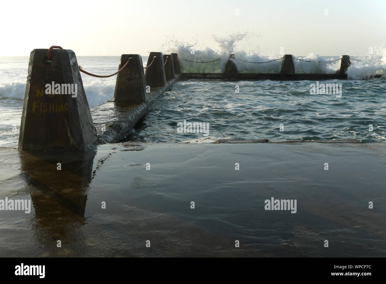 Durban, South Africa, wave crashing against wall of tidal swimming pool