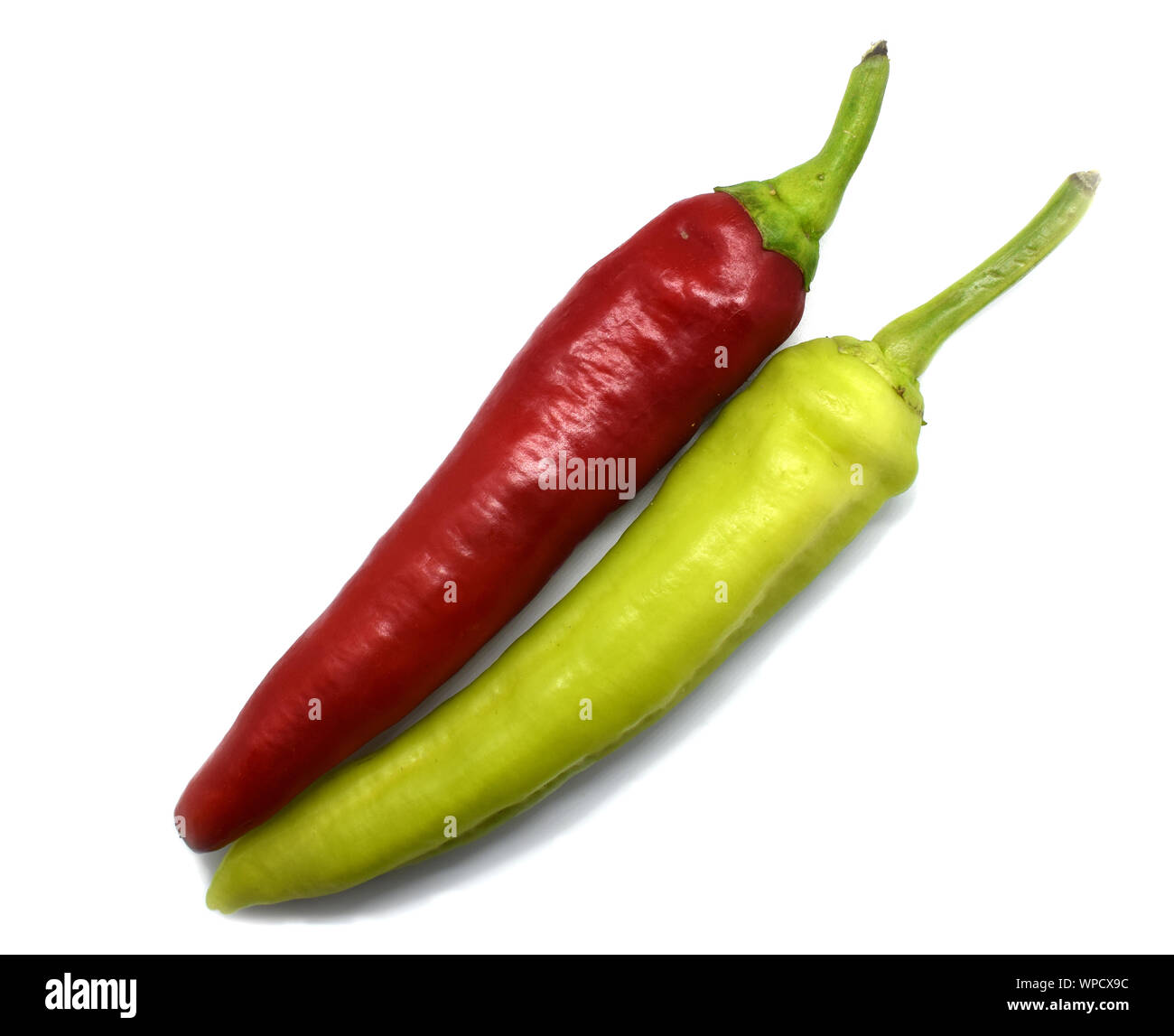 Red and green pepper on a white background Stock Photo - Alamy