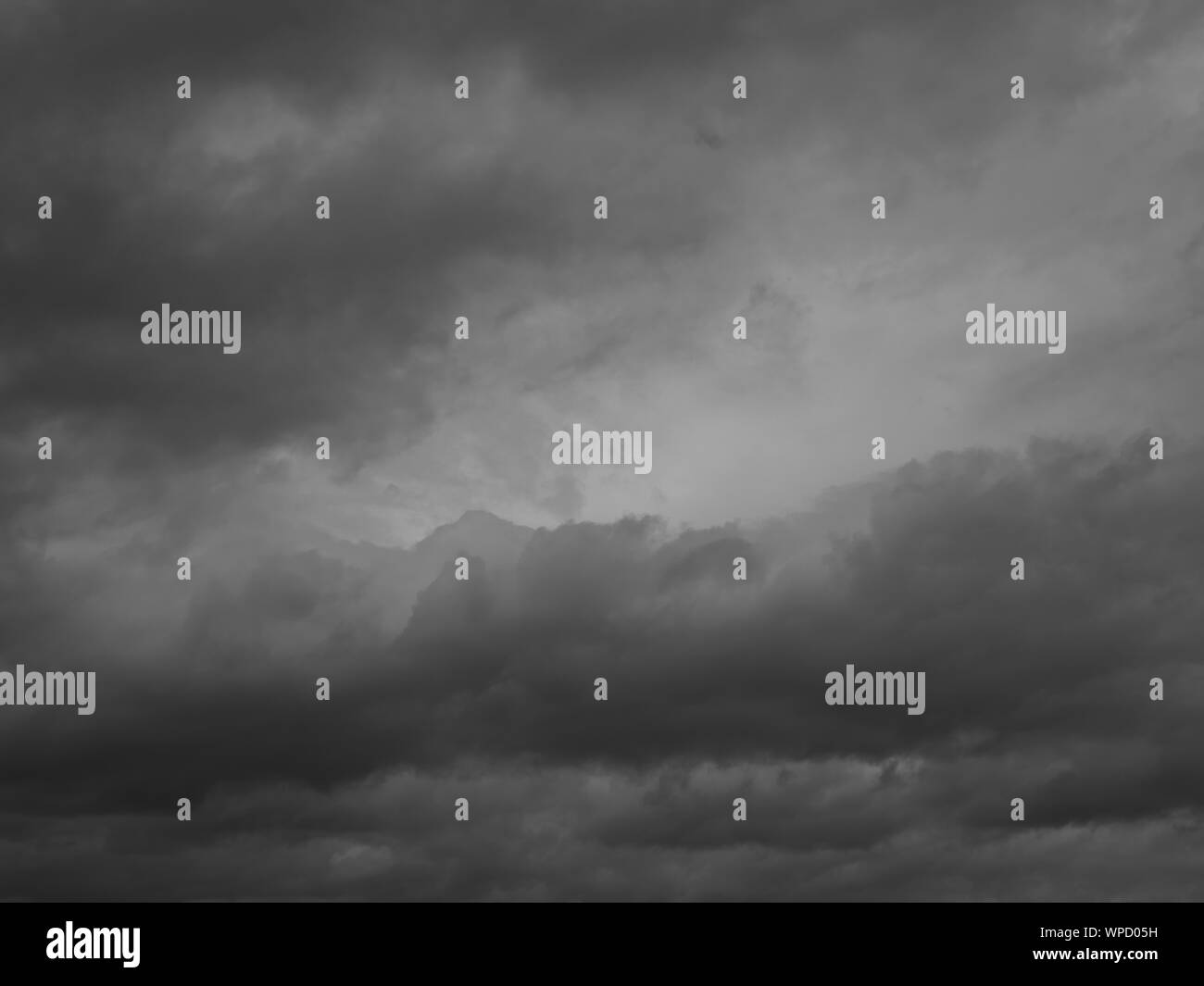 Cumulonimbus cloud formations on tropical sky, Nimbus moving , Abstract background from natural phenomenon and grey clouds hunk , Thailand Stock Photo