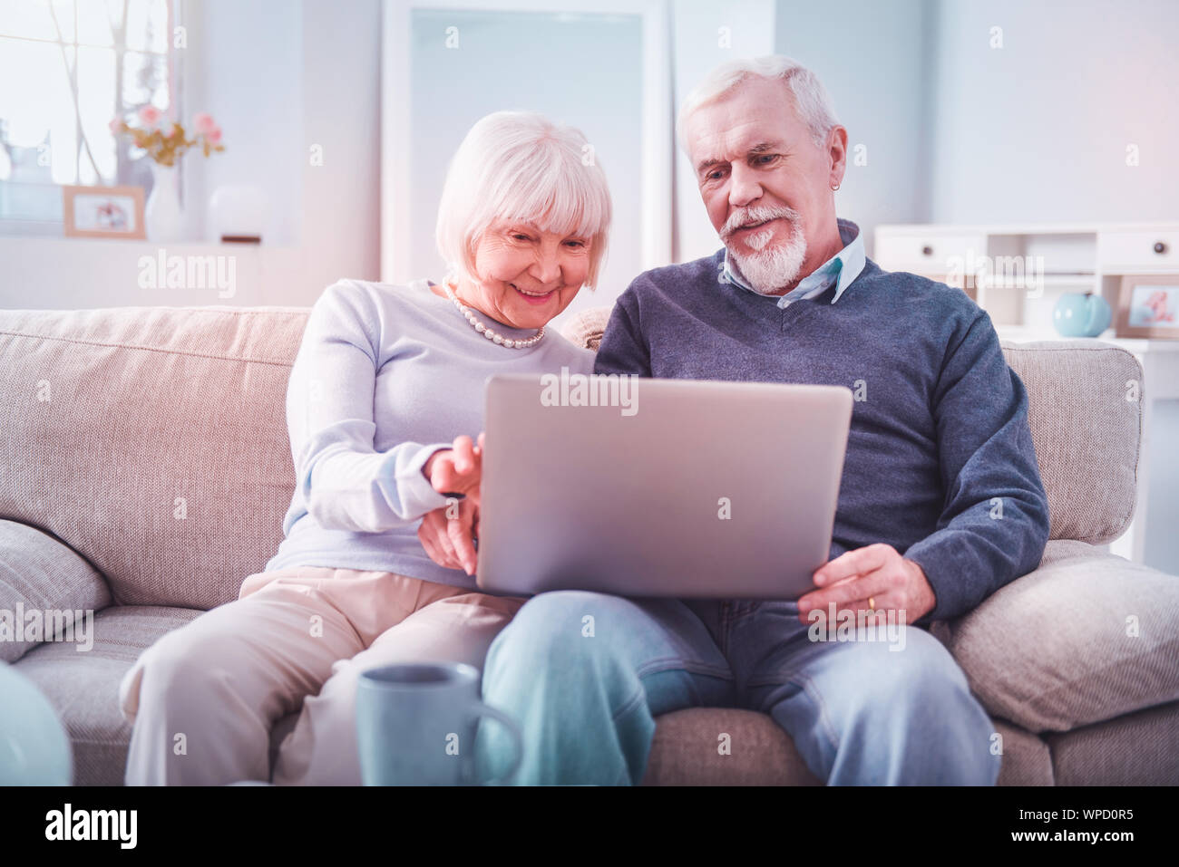 Mature woman watching film at home hi-res stock photography and images ...