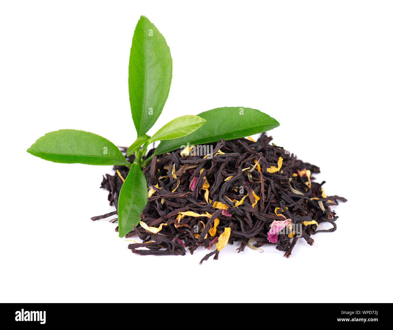 Black ceylon tea with rose petals, cornflowers and sunflower, isolated ...
