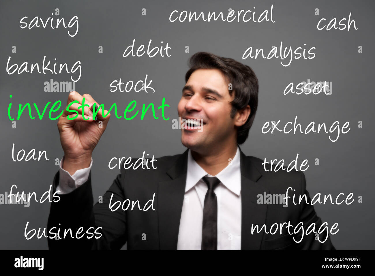 Businessman writing finance concepts Stock Photo