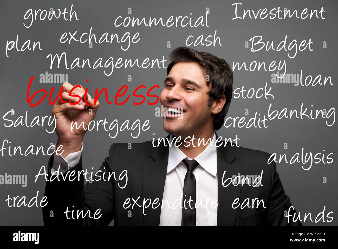 Businessman writing finance concepts Stock Photo