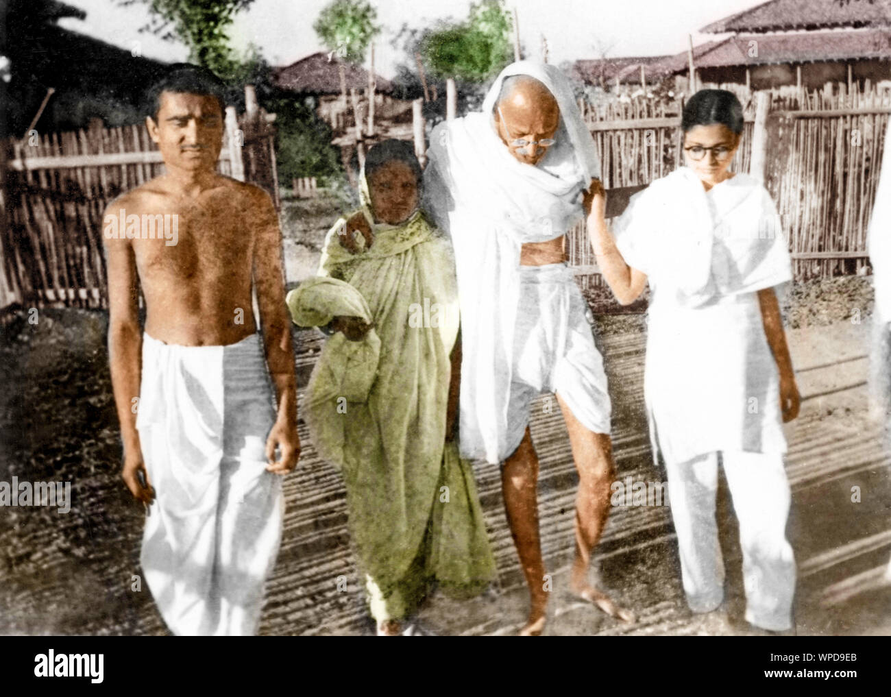 Mahatma Gandhi walking with Kanu Gandhi and Abha Gandhi, Wardha, India, Asia, 1936 Stock Photo