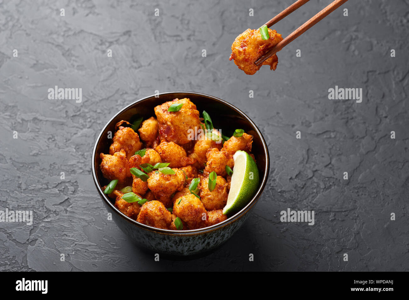 Gobi Manchurian in bowl at black concrete background. Gobi Manchurian