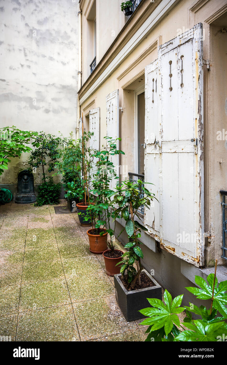 Rotten Shutter Classic houses with peeling stone walls, wooden rotten shutters ...