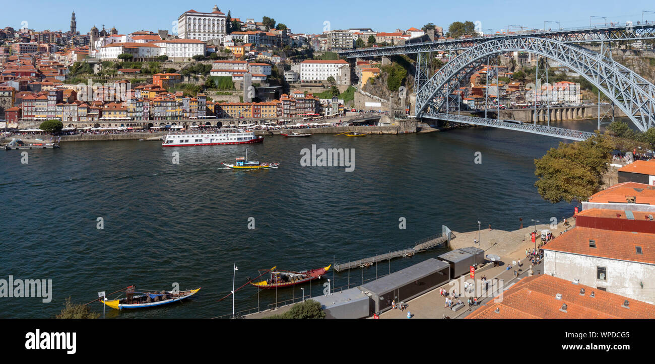 Porto, Portugal.  Dom Luis I bridge crossing the Douro river and linking Vila Nova de Gaia, bottom, and Porto, top.  The boats, called rabelos, once t Stock Photo