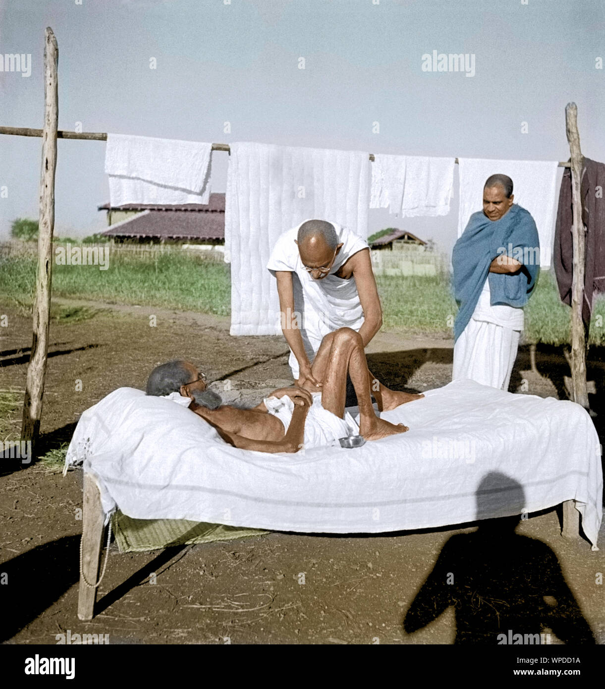 Mahatma Gandhi caring leper patient, Wardha, India, Asia, 1940 Stock Photo