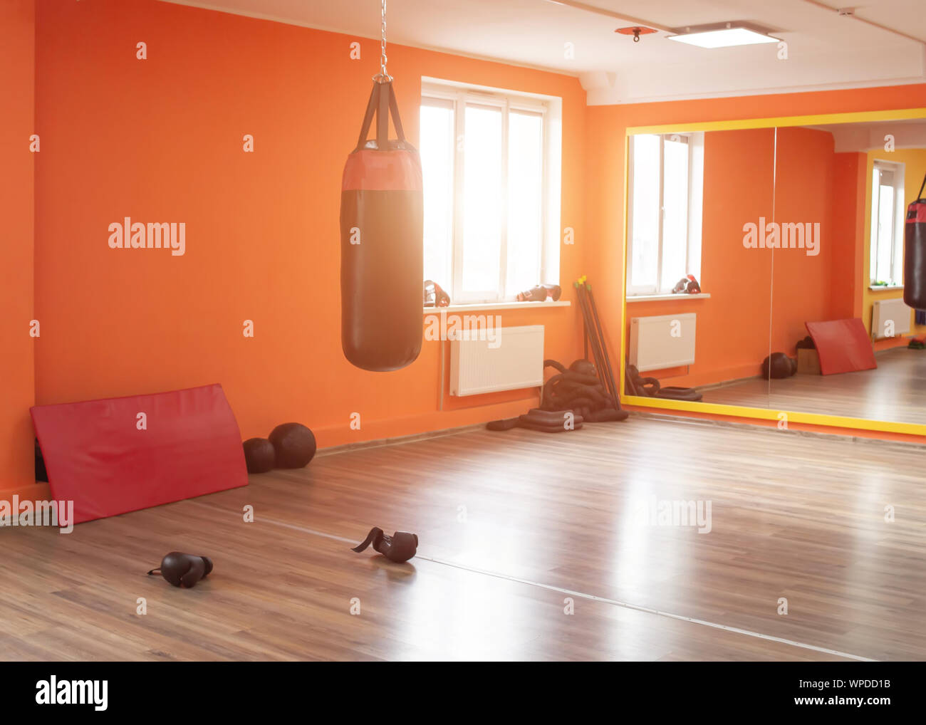 New martial arts gym, punching bag, sunlight shining through the window Stock Photo