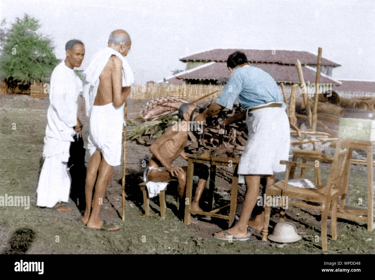 Mahatma Gandhi seeing leper patient Parchure Shastri being treated, Wardha, India, Asia, 1940 Stock Photo