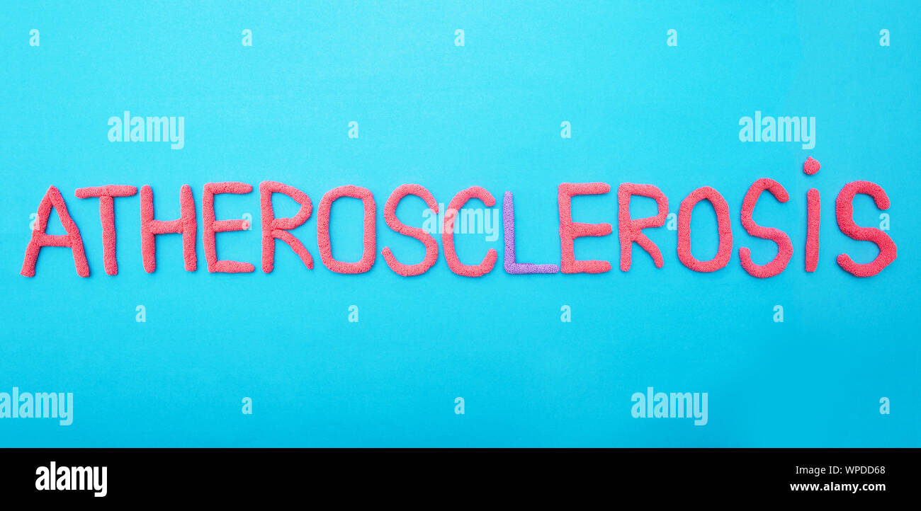 Atherosclerosis inscription in red letters on a blue background concept of vascular disease Stock Photo