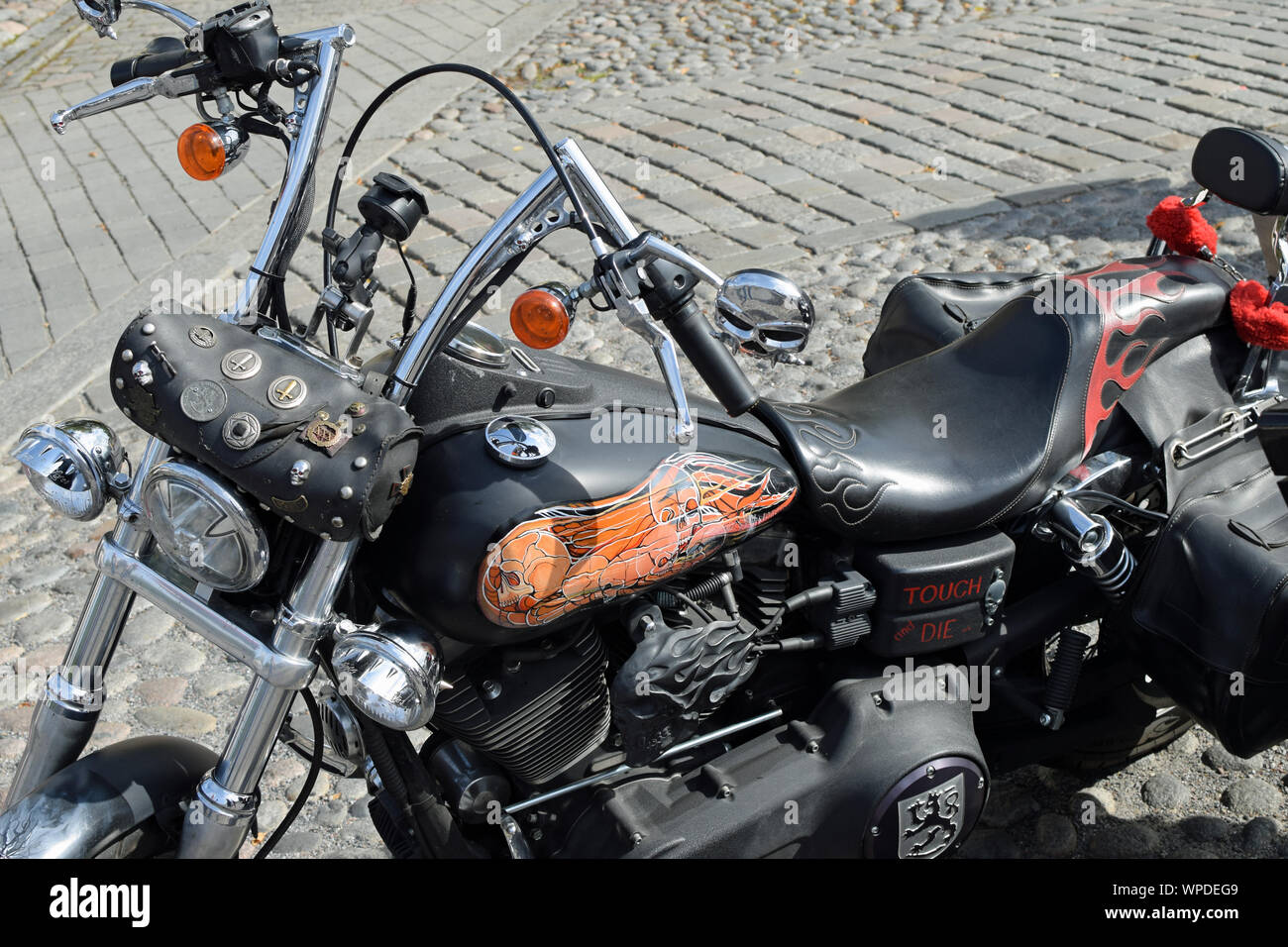 Tampere, Finland - August 31, 2019: Customized motorcycle at the bike show Mansen Mäntä Messut (Tampere piston fair in English) with skull theme. Stock Photo