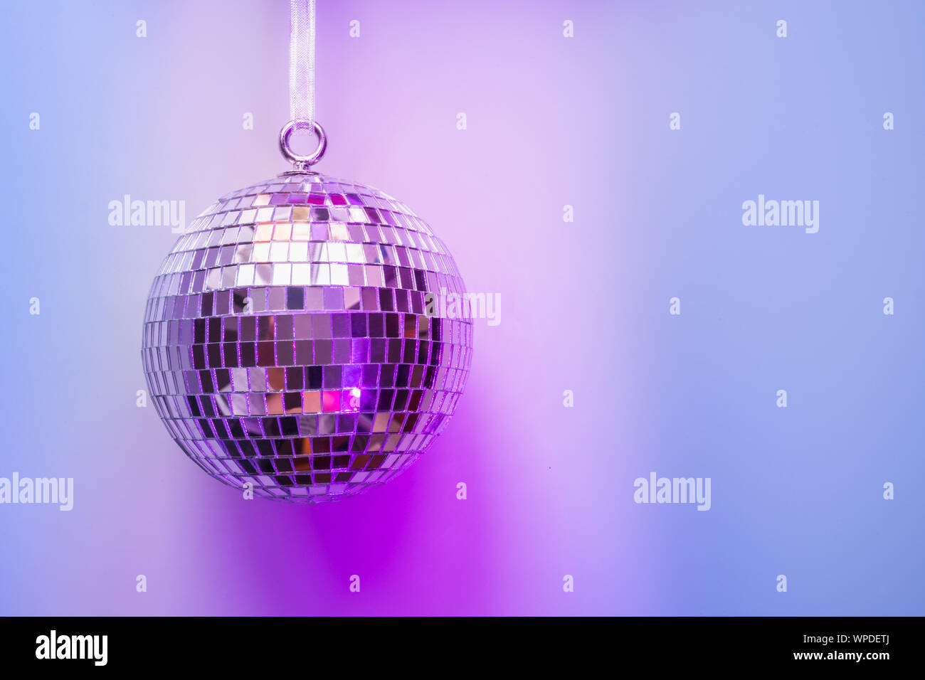 disco ball bauble on pink background. party concept Stock Photo - Alamy