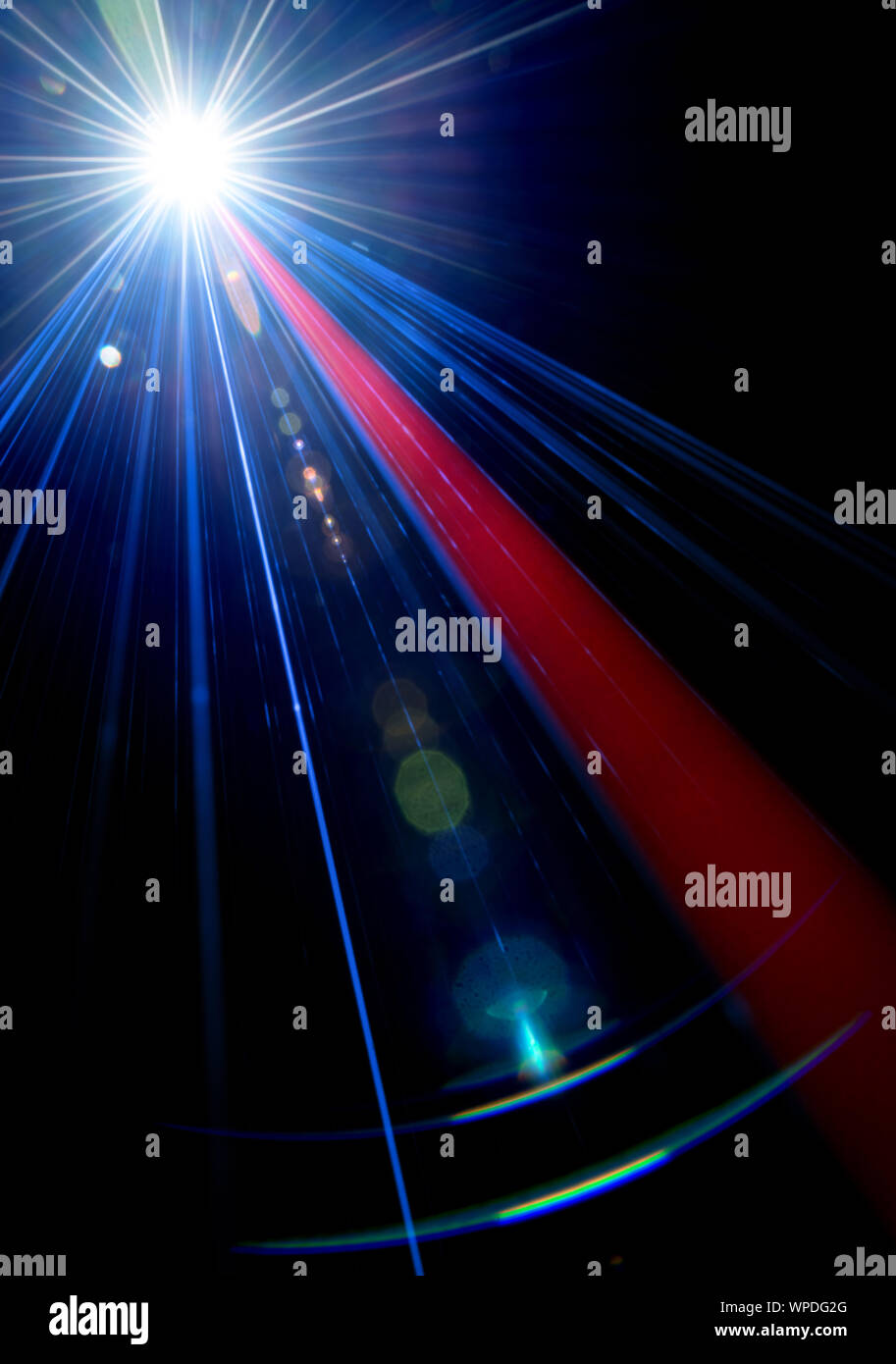 Red an blue stage light effect with lens flare on black background, photo. Stock Photo