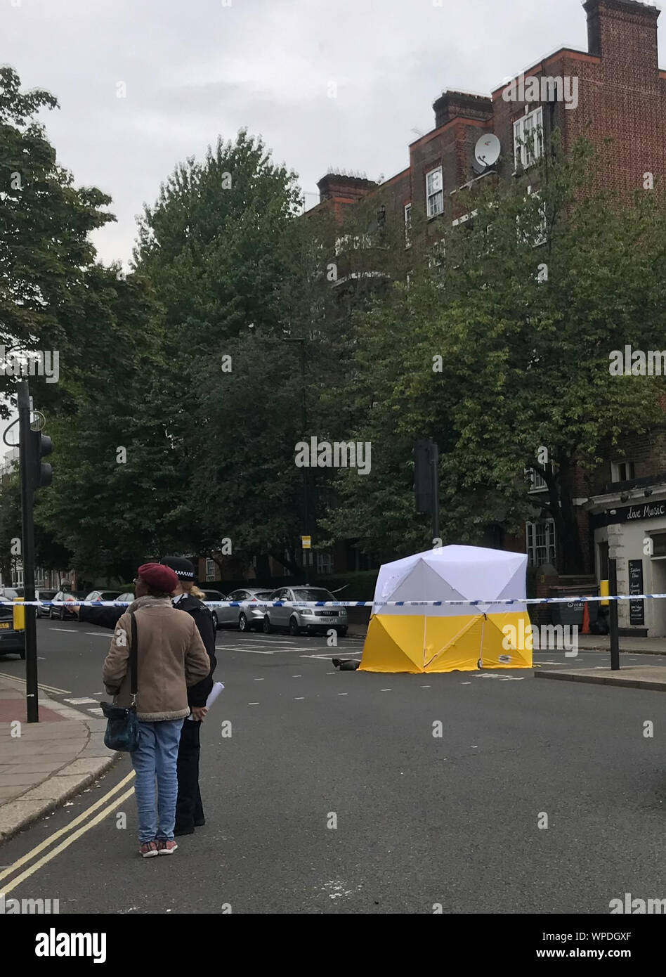 The scene at the junction of Malden Road and Prince of Wales Road, Kentish Town, north-west London, where a man was found with a gunshot wound after police, including armed officers, were called to a shooting late on Sunday night. Stock Photo