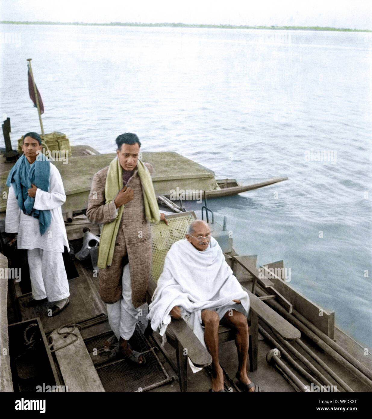 Sudhir Ghosh, Ramkrishna Bajaj, Mahatma Gandhi on boat to Midnapur, East Bengal, India, Asia, December 24, 1945 Stock Photo