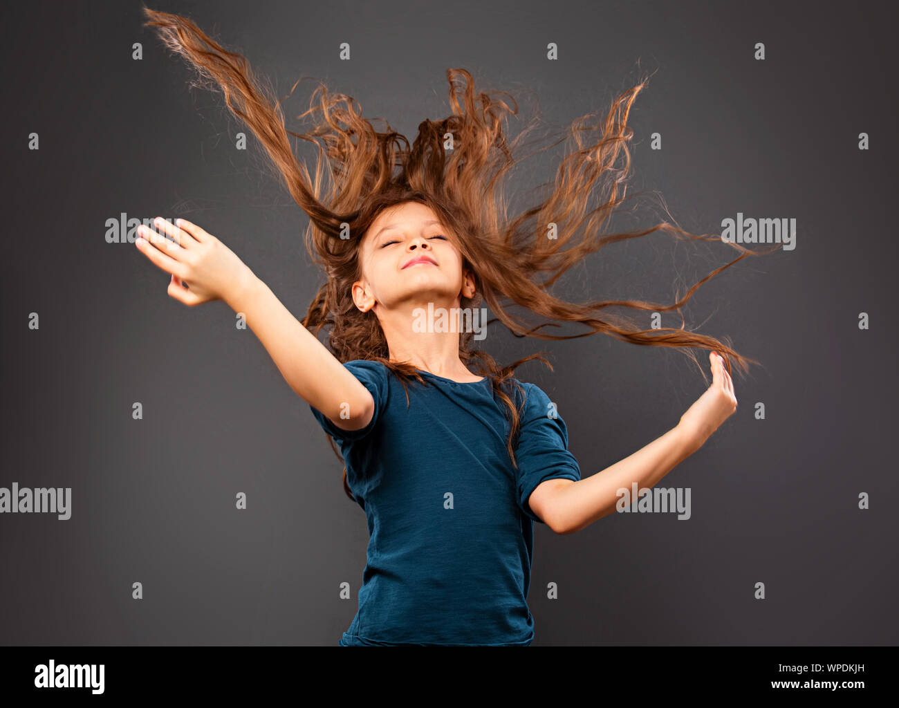 Active Kid Girl Twist And Throwing Strong Healthy Long Curly Hair