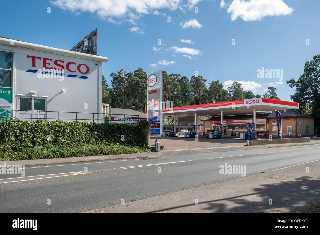 Tesco supermarket and Esso garage or petrol station in Bordon, Hampshire, UK Stock Photo