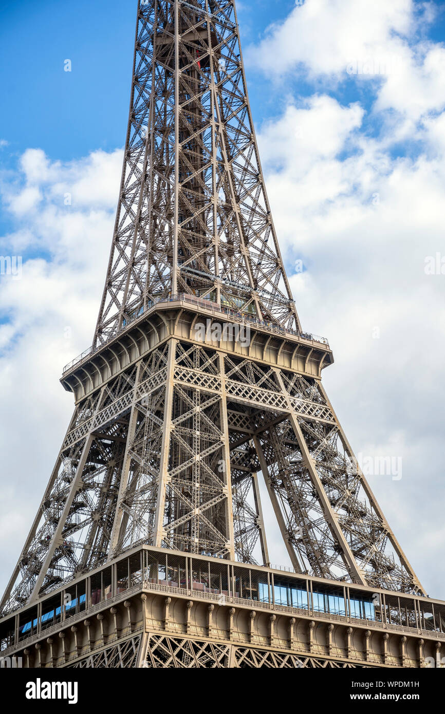 Resting in the cloudy sky the France symbol famous Eiffel Tower with a ...