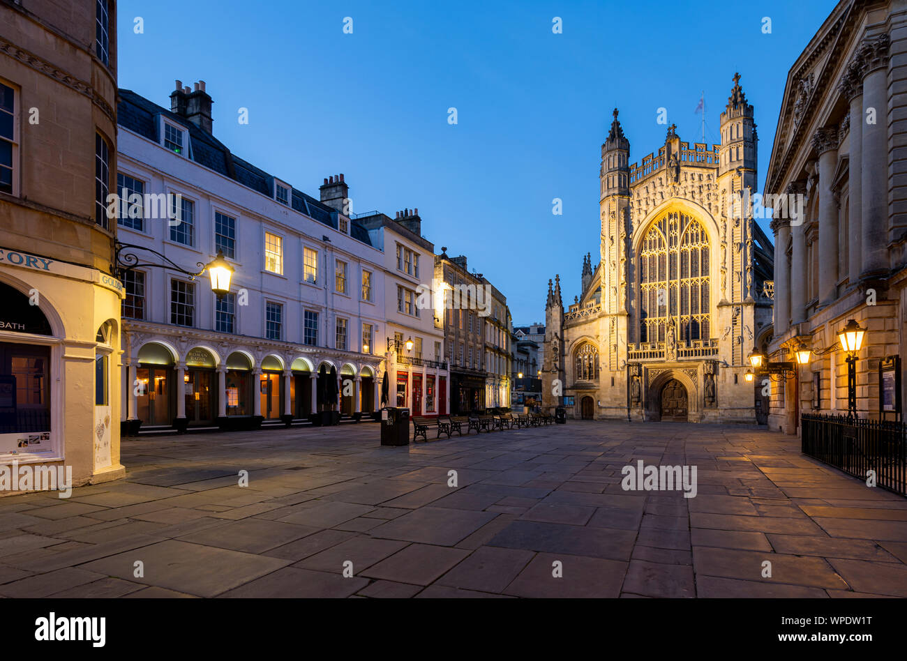 The historic square outside Bath Abbey and the Roman Baths at dusk. Stock Photo