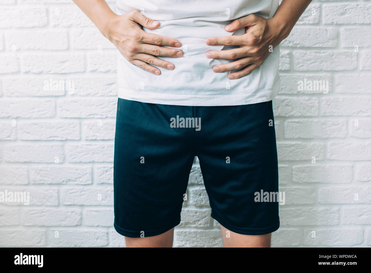 cropped male body suffering stomach ache. diarrhea, cramping and abdominal pain Stock Photo