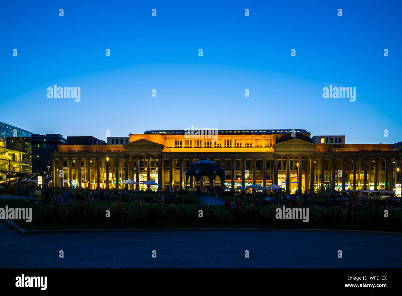 Stuttgart, Germany, August 25, 2019, Illuminated koenigsbau building at schlossplatz square in downtown at famous king street with many people enjoyin Stock Photo