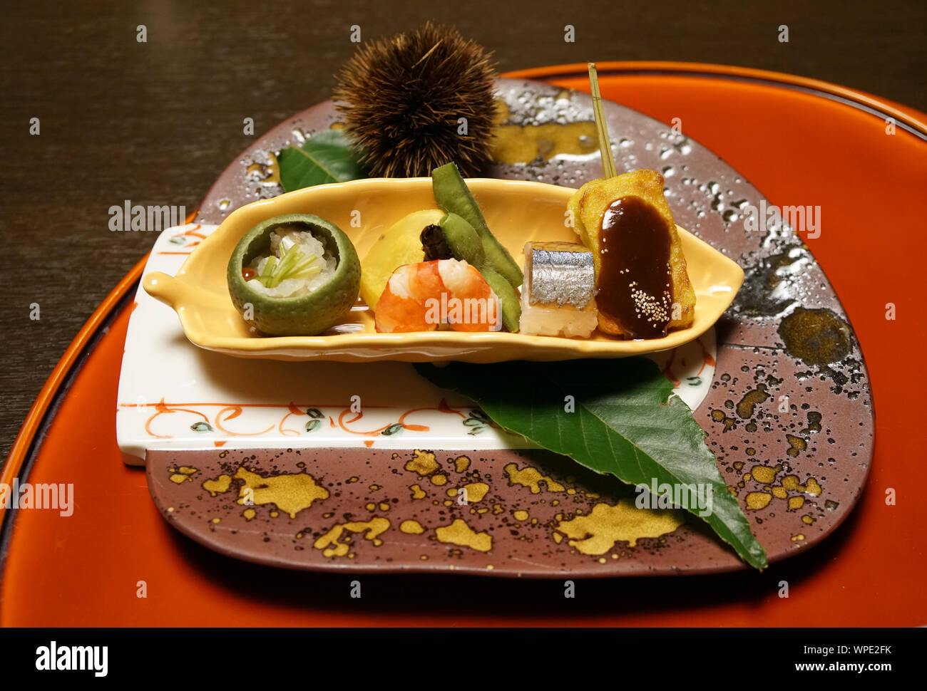 Appetizer with shrimp, edamame, chestnut, mochi, and kohada sushi