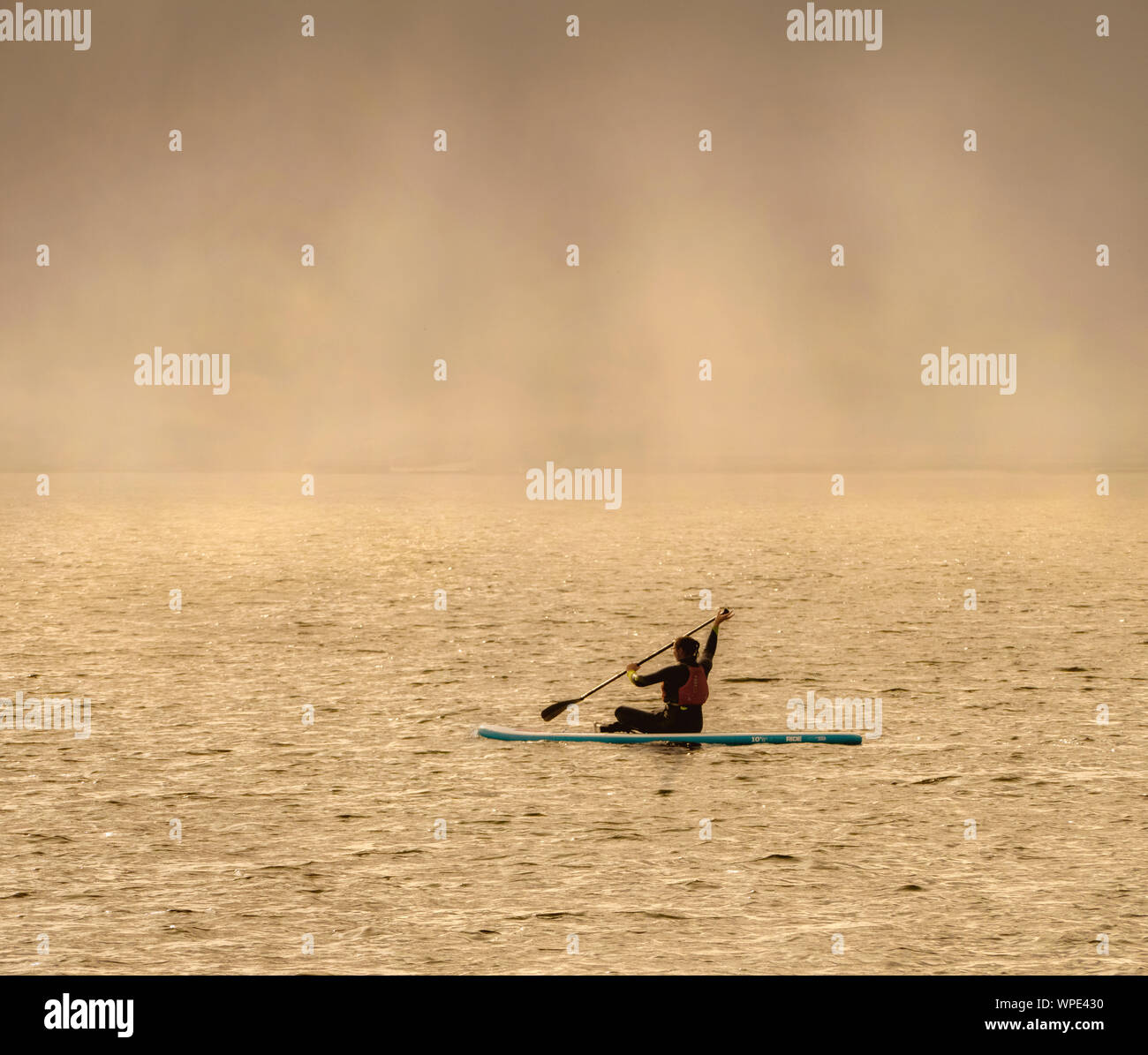 Canoeist at Sunset Stock Photo