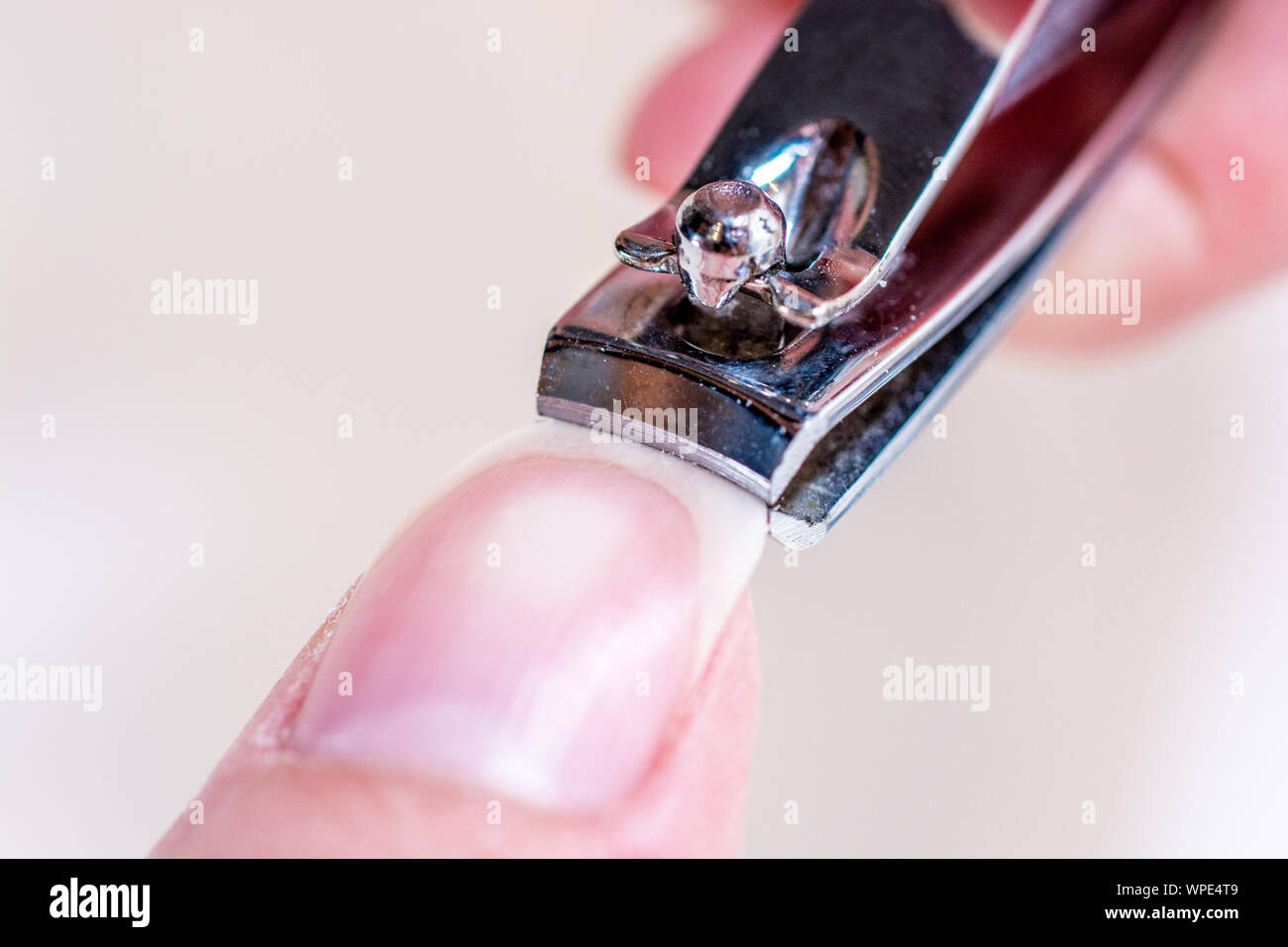 Fingernails are shortened with nail clippers Stock Photo