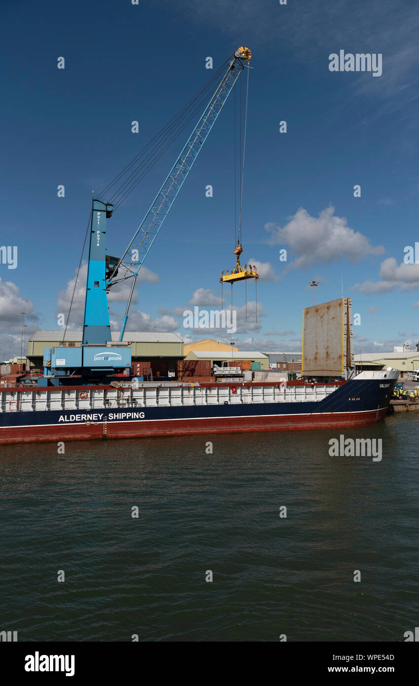 Poole Harbour, Dorset, England, UK. September 2019. The Valiant a general cargo vessel unloading from her berth in Poole Harbour. Stock Photo