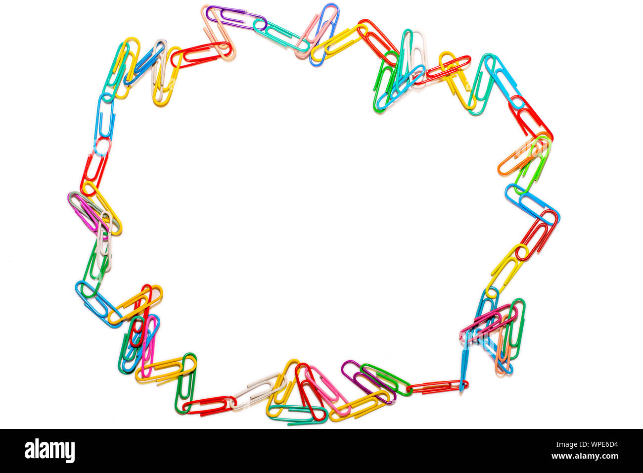 Wild circle of colored paper clips on white background Stock Photo