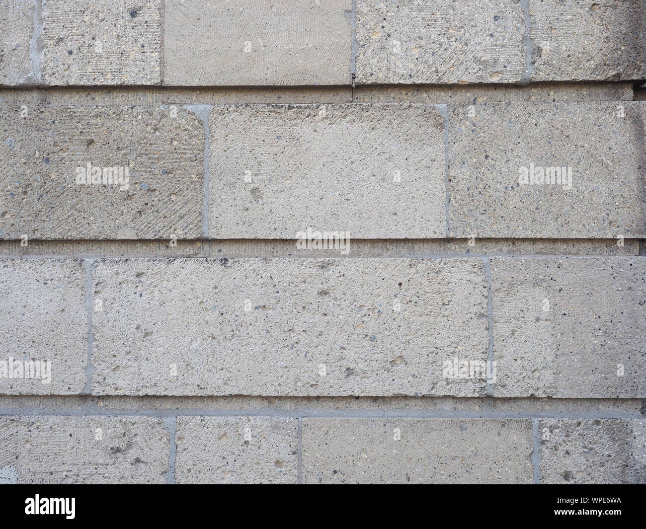 grey stone wall useful as a background Stock Photo - Alamy