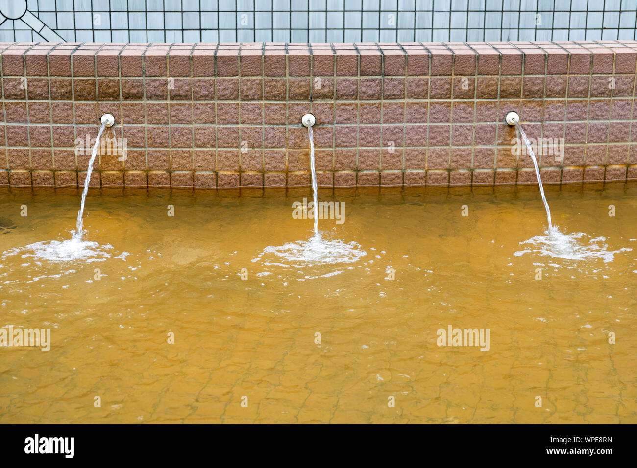 Yellow Water Fountain Pond in Hong Kong Stock Photo Alamy