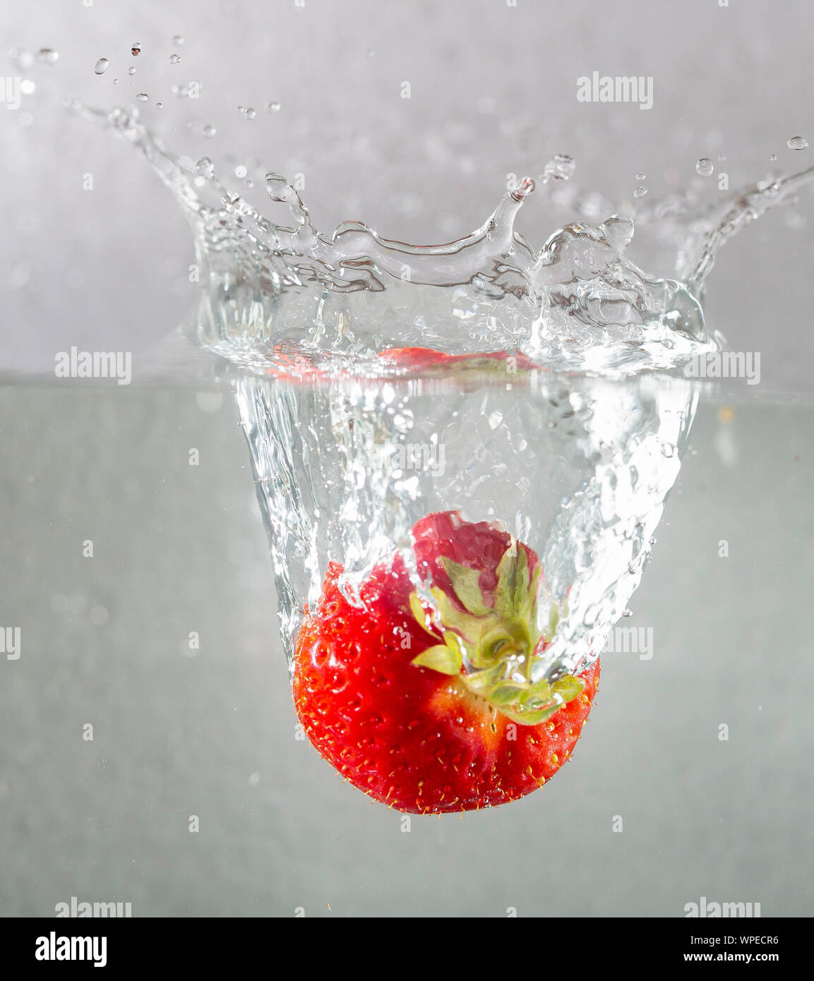 Strawberry drops in water Stock Photo Alamy