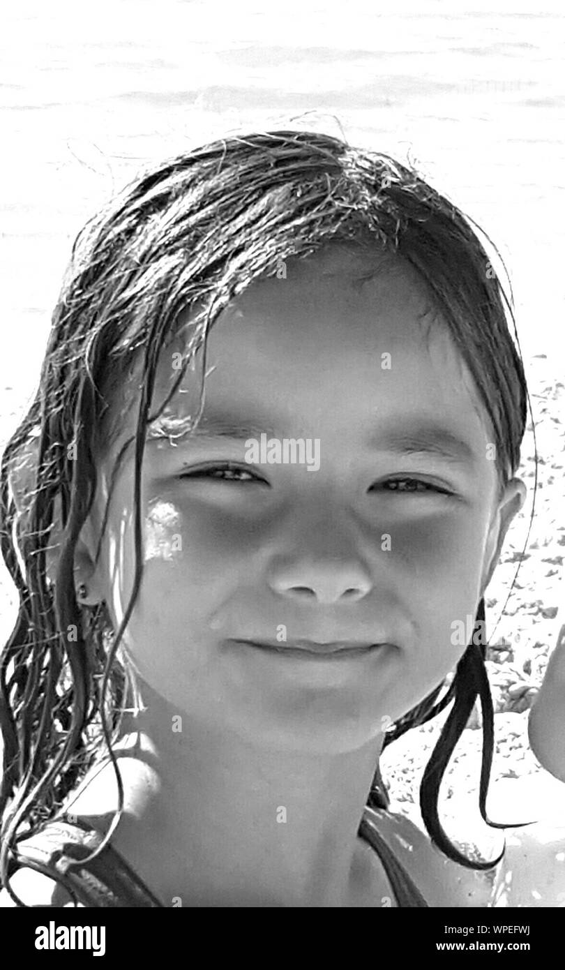 Close-up Portrait Of Girl With Wet Hair At Beach Stock Photo