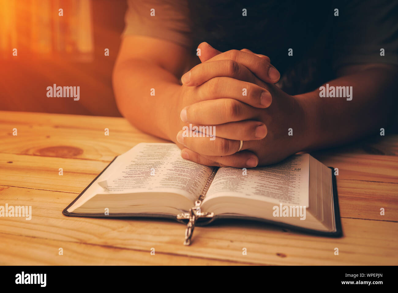 pics Hands Background Praying Images https www alamy com christian hand while praying and worship for christian religion with blurred of her body background casual man praying with her hands together over a image272003053 html