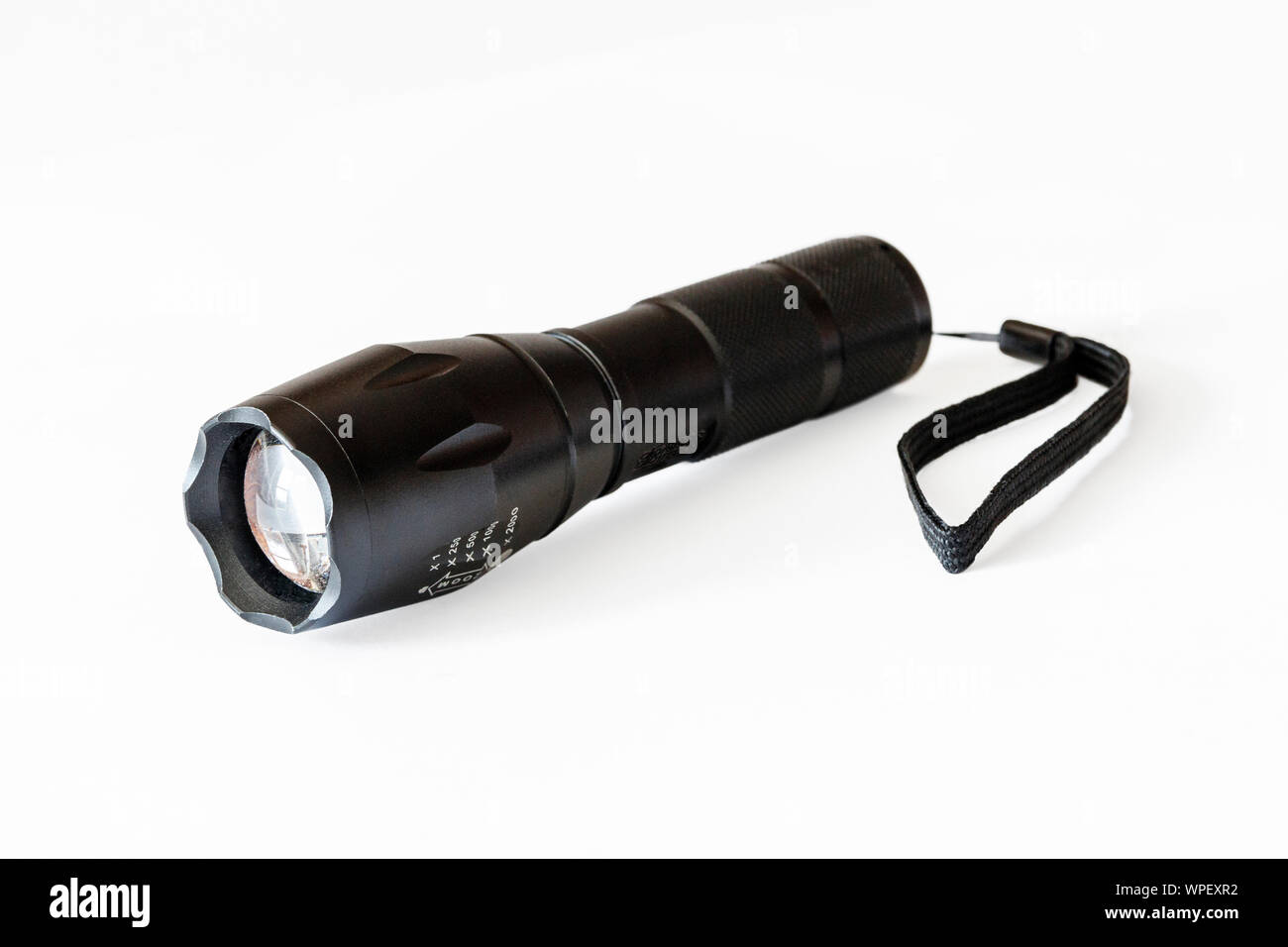 High-power black pocket torch isolated against a white background Stock Photo