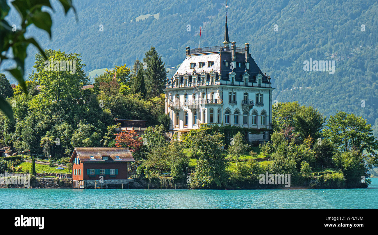 The Beautiful castle of Iseltwald located on the crystal clear blue waters  of Lake Brienz in Central Switzerland Stock Photo - Alamy